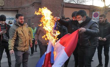 Hundreds of protesters shouted “Death to France”