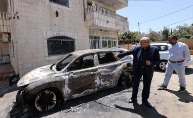 ab-Israeli Knesset member Ahmed Tibi inspects the damage at the site of an attack by Israeli settlers on the village of Turmus Ayya 