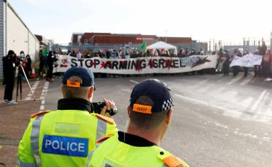 "Stop Arming Israel", reads the banner