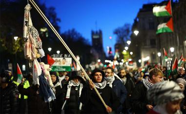 Thousands of people have worn keffiyehs in huge protests in Britain 