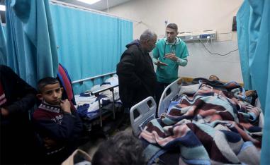 A Palestinian man wounded in an Israeli strike lies on a bed at Nasser hospital in Khan Younis  last month