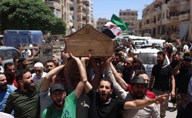 Syrians attend the funeral procession of a man killed during clashes with Turkish troops in Afrin in northern Syria