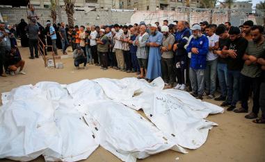 Funeral prayers next to the bodies of Palestinians including members of Abu Taima family, who were killed in an Israeli strike in Khan Younis