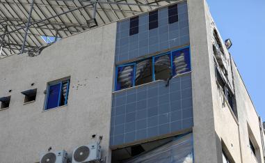 Al-Ahli Arab Baptist hospital stands damaged following an Israeli strike