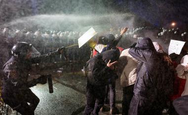 Police officers use pepper spray on demonstrators during a protest against the detention of Istanbul Mayor Ekrem Imamoglu