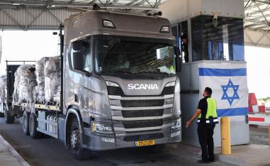 A trucks carrying humanitarian aid drives through the Kerem Shalom crossing 
