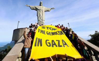 Activists hold a banner that reads Stop the genocide in Gaza during a protest to demand an immediate ceasefire in the region and the urgent entry of humanitarian aid for the Palestinians, at the Christ the Redeemer statue in Rio de Janeiro, Brazil June 14