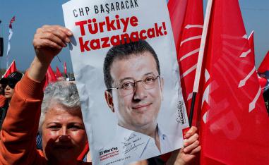 A person holds a placard during a rally to protest against the arrest of Istanbul Mayor Ekrem Imamoglu