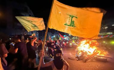 Hezbollah supporters protest against the government's decision to disarm the militant group