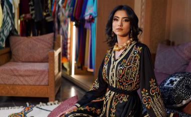 A model wearing the Moroccan caftan poses for a picture. 
