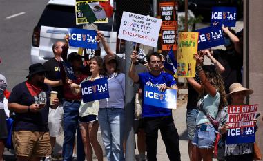 Dodgers fans protest against the US Immigration and Customs Enforcement (ICE) and federal immigration sweeps  in Los Angeles