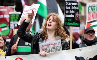 A protester chants during a march organised by the Palestine Solidarity Campaign on the International Day of Solidarity with the Palestinian People in London