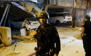 Emergency personnel respond following Iranian missile barrages in central Israel