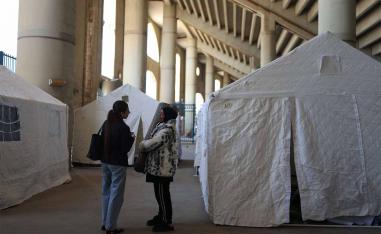 Displaced women shelter in a stadium in Beirut