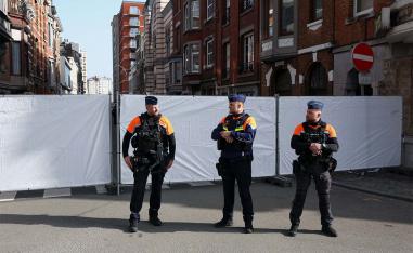 Police secure the site near a synagogue damaged by an explosion in Liege