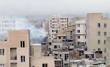 Smoke rises from a building following a reported strike in Tehran