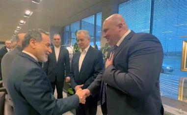 Araqchi shaking hands with Russian officials upon his arrival to St Petersburg