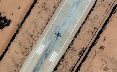 A satellite image shows a combat drone, which experts identified as most likely a Chinese-made Feilong-1, on the runway at Al Khadim airbase