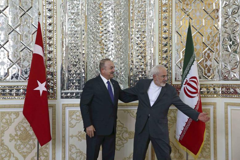 Iranian FM with Turkish counterpart in Tehran, last February