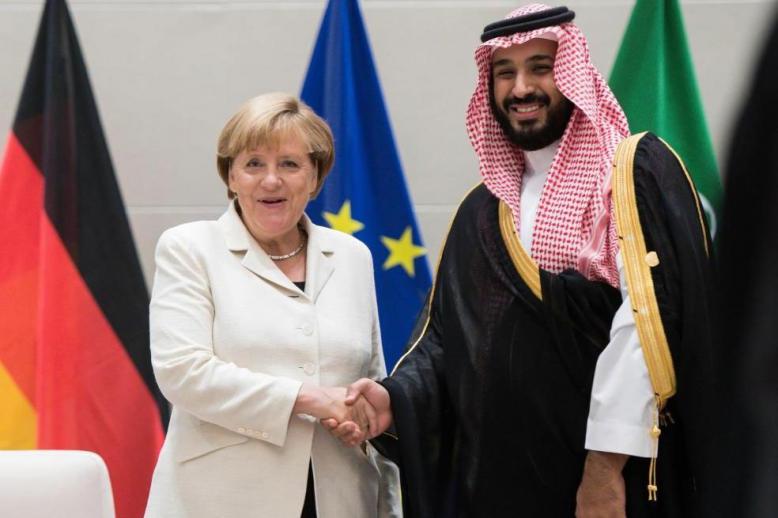 German Chancellor Angela Merkel shaking hands with Saudi Crown Prince Mohammed bin Salman 