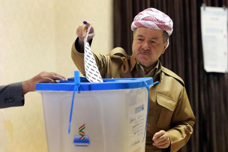  Former leader of the Iraqi Kurdish Regional Government (IKRG) Masoud Barzani gestures after casting his ballot for the parliamentary election at a polling station in Arbil, the capital of the Kurdish autonomous region in northern Iraq