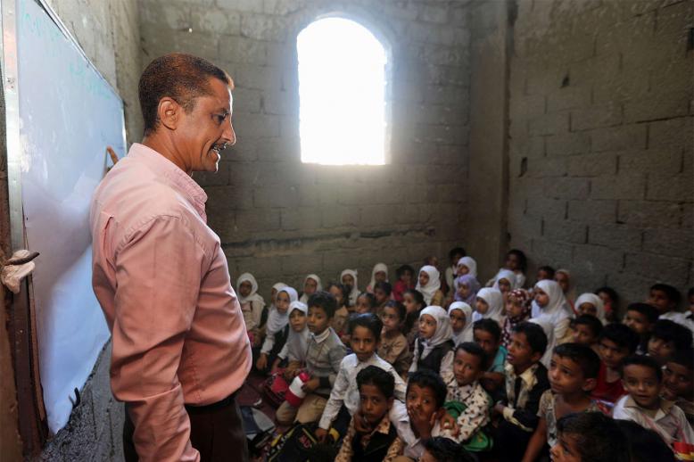 Yemeni children attend class in a house turned into a makeshift school in the southwestern city of Taiz 