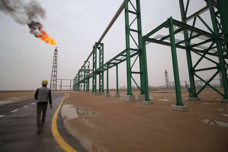  An employee walks at the Zubair oil and gas field in Basra, last May