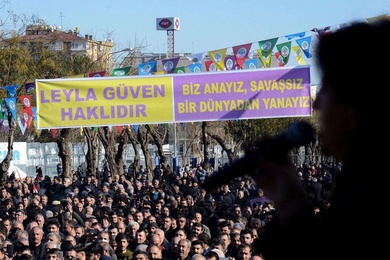 Protesters gather under a banner reading "Leyla Guven is right" during a rally in the Kurdish-majority city of Diyarbakir