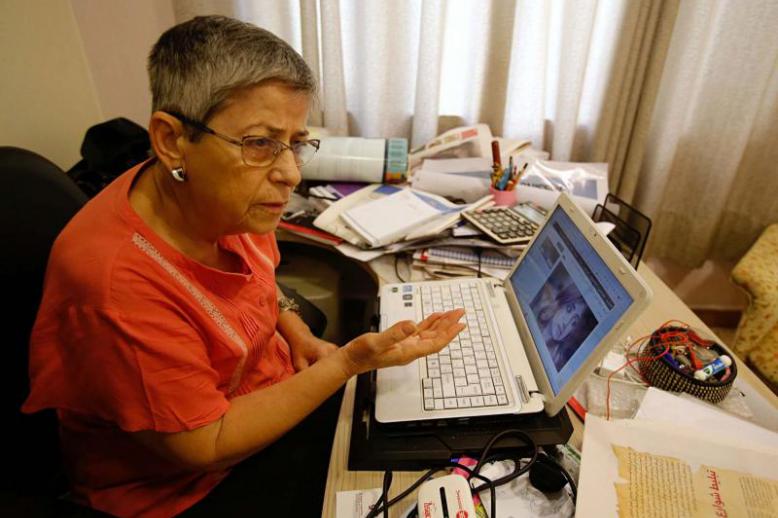 Activist Hana Adwar speaks as she follows online news of the the assassination of Tara Fares in Baghdad