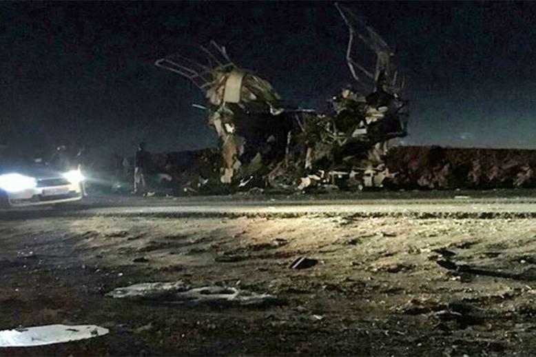 A picture released by the semi-governmental agency Fars News shows the damaged bus that was carrying members of Iran's Revolutionary Guards 