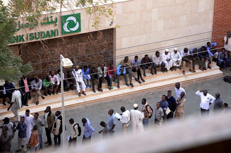 Many residents have to line up for hours to withdraw money