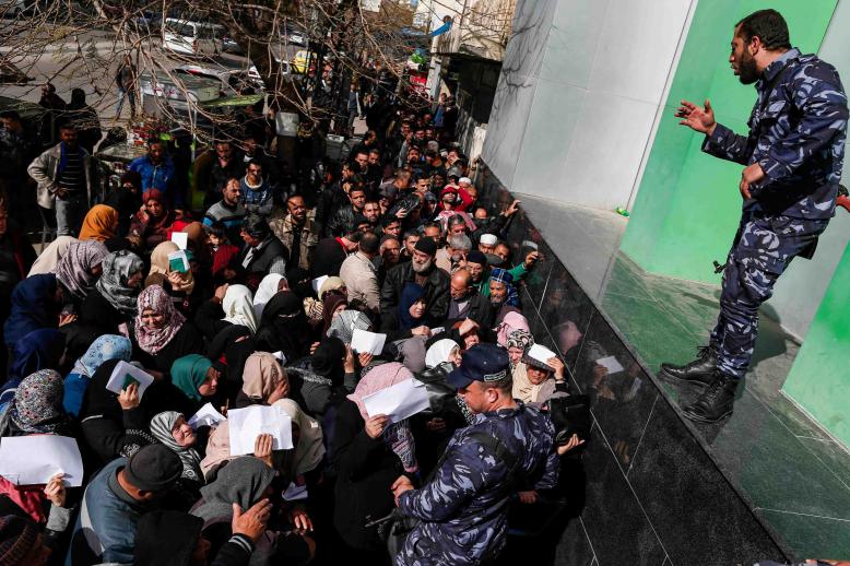 Thousands of Palestinians could be seen queueing early at post offices across Gaza