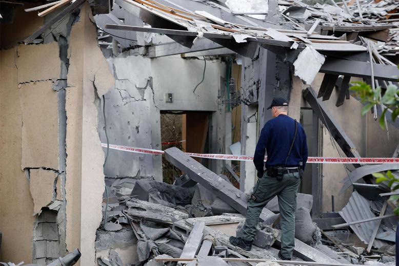 A damaged house after it was hit by a rocket in the village of Mishmeret