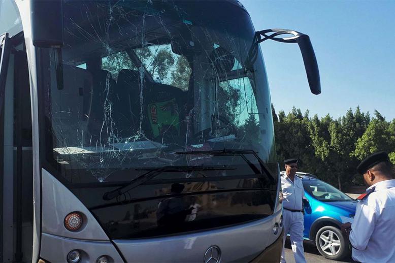Tourist bus damaged during a bomb blast near Giza pyramids.