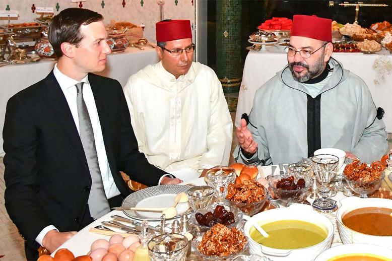 Moroccan King Mohammed VI (R) sharing an Iftar meal with Senior Advisor to US President Jared Kushner (L) at the Royal Residence in Rabat