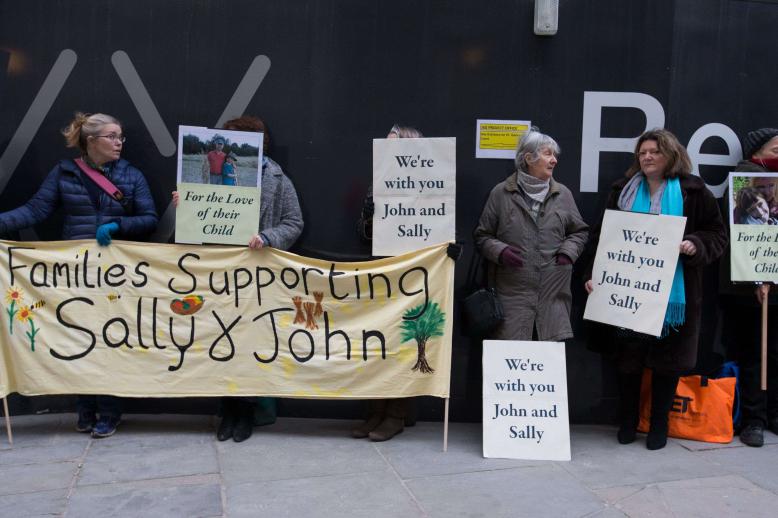 Supporters of John Letts and Sally Lane, parents of Jack Letts who is believed to have left the UK to join Islamic State (IS) hold banners outside the Old Bailey in central London
