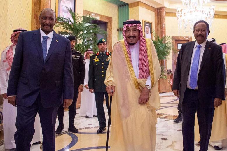 Saudi King Salman bin Abdulaziz Al Saud (C) receives head of the Ruling Council of Sudan Abdel Fattah al-Burhan (L) and Sudanese Prime Minister Abdallah Hamdouk