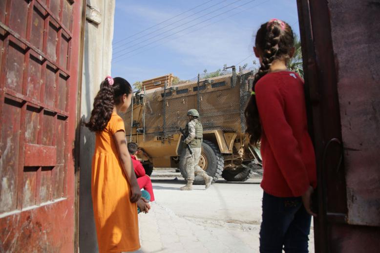 Turkish soldiers patrol the northern Syrian town of Tal Abyad on the border between Syria and Turkey