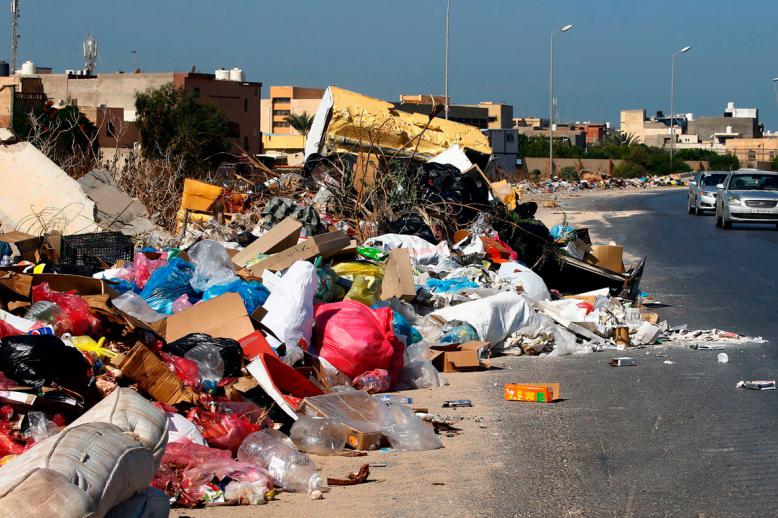 A view of rubbish piling up along the side of a street in the Libyan capital Tripoli