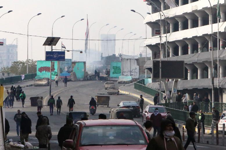 Iraqi anti-government protesters gather at al-Sinek bridge in the capital Baghdad