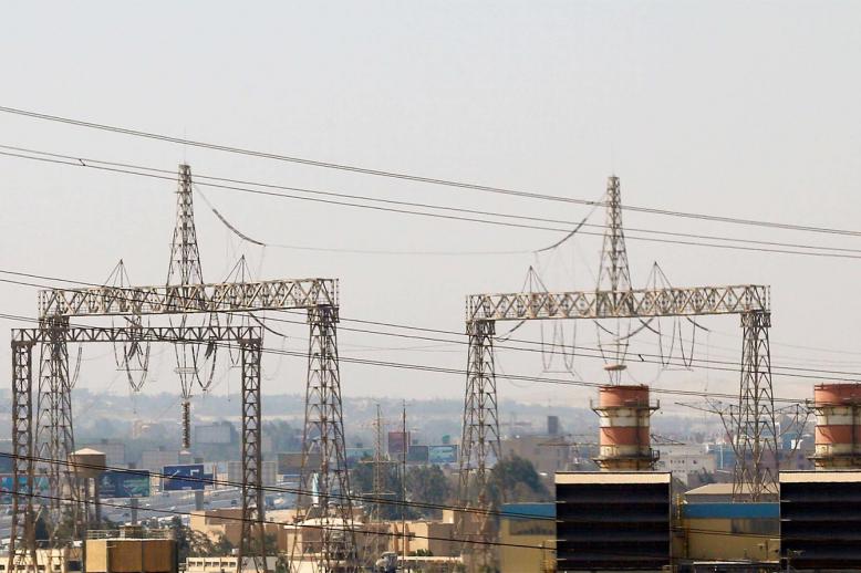 Electricity pylons and power transmission lines are seen in Cairo