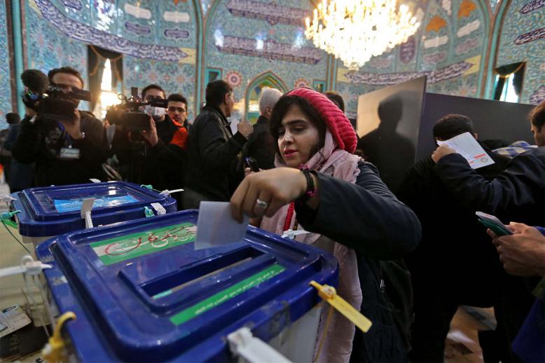 iranian woman casts her ballot
