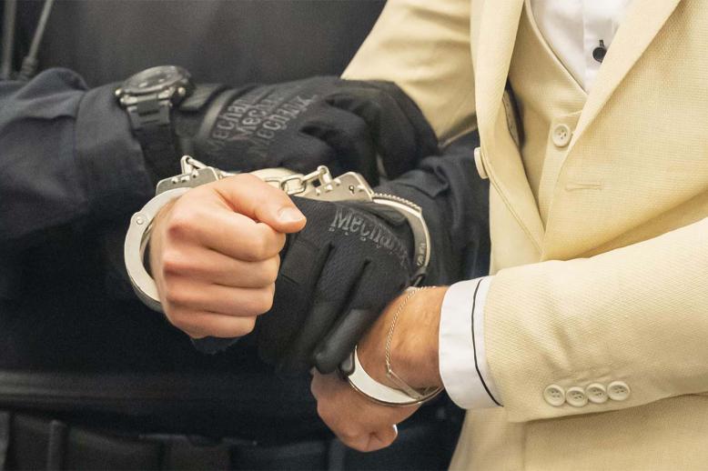 Handcuffed defendant