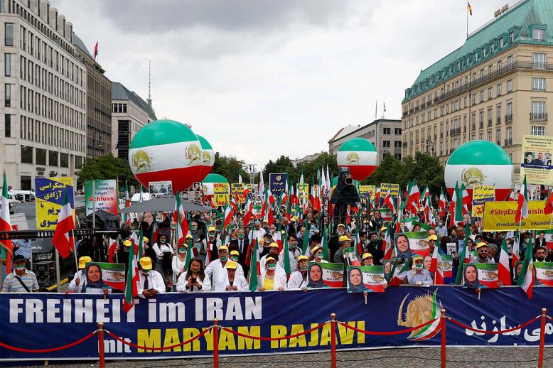 Supporters of Iranian opposition leader Maryam Rajavi and the National Council of Resistance of Iran (NCRI) gather to protest against the death penalty in Iran