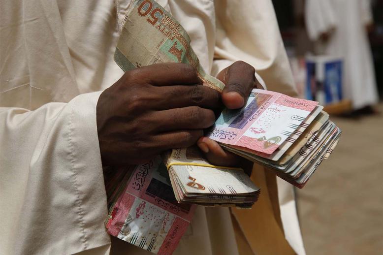 Sudanese pound's official rate is 55 to the US dollar, compared to 140 on the black market
