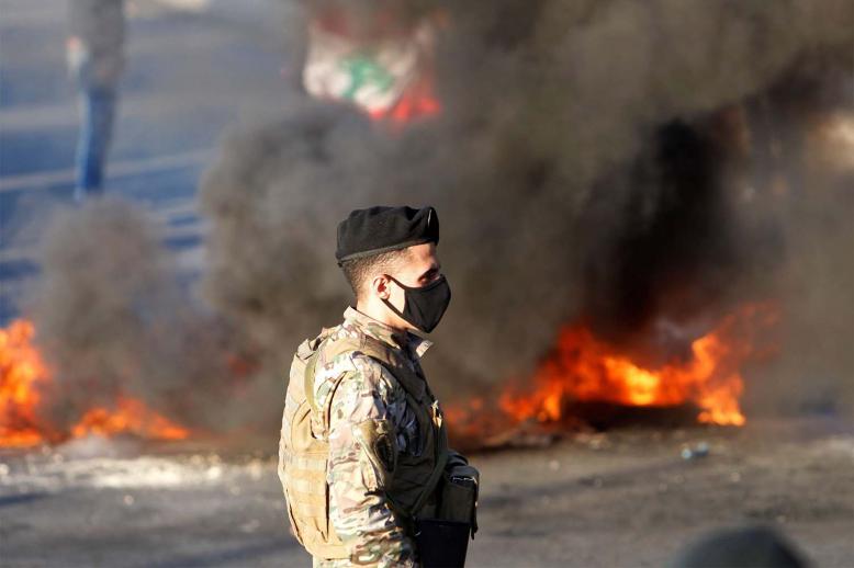 Demonstrators burnt tyres in Martyrs' Square in central Beirut