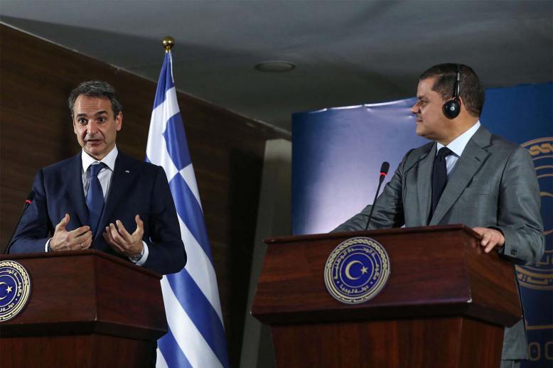 Libya's interim prime minister Abdul Hamid Dbeibah (R) and Greece's Prime Minister Kyriakos Mitsotakis (L)