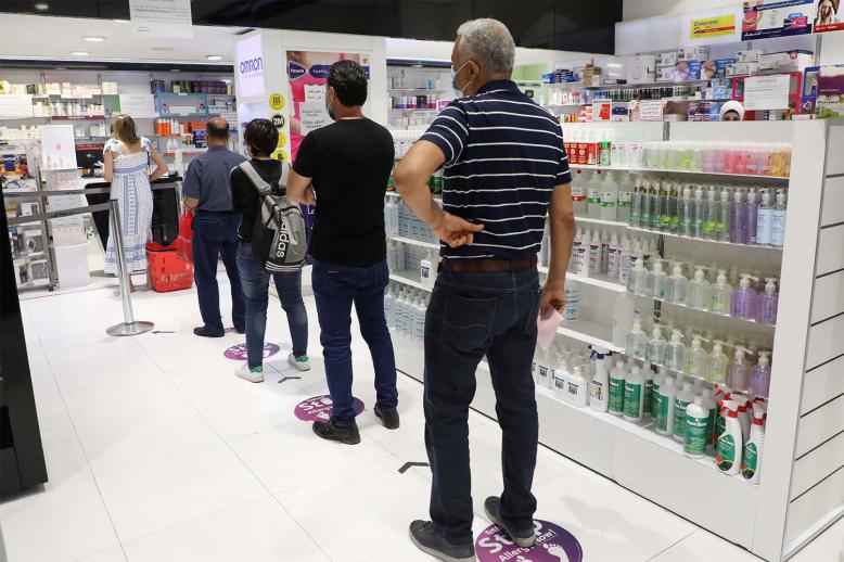 Lebanese queue up in a pharmacy