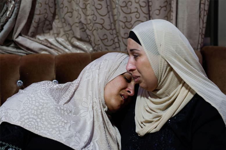 The mother of Palestinian Muhammad Al-Shaham in a state of shock