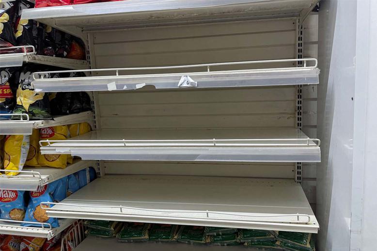 Empty shelves are seen in the rice section inside a supermarket in Tunis